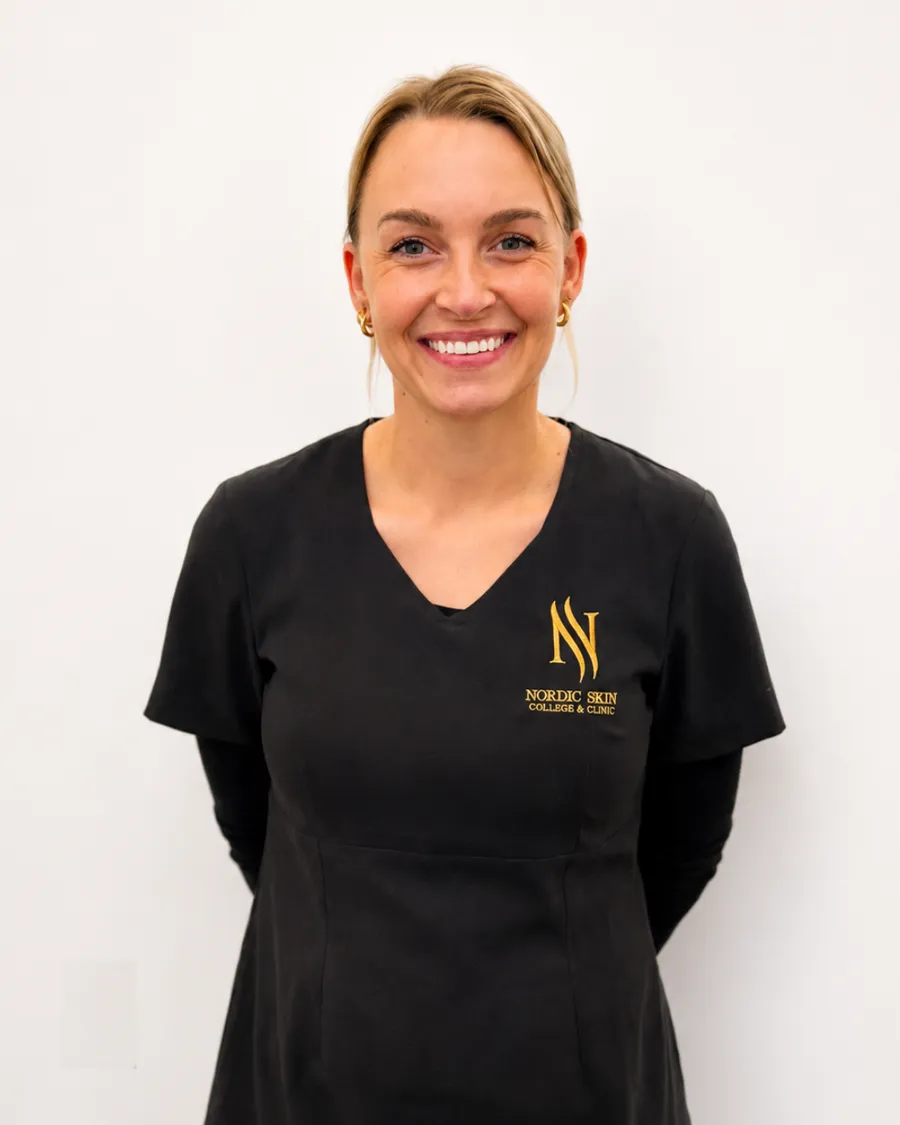 Debbie, cosmetology student at Nordic Skin College at Kongens Nytorv, in the school uniform