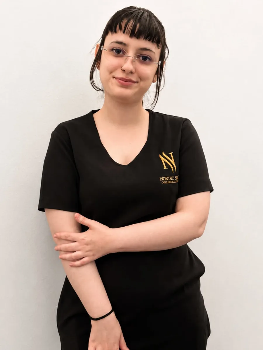 Esma, cosmetology student at Nordic Skin College at Kongens Nytorv, in the school uniform