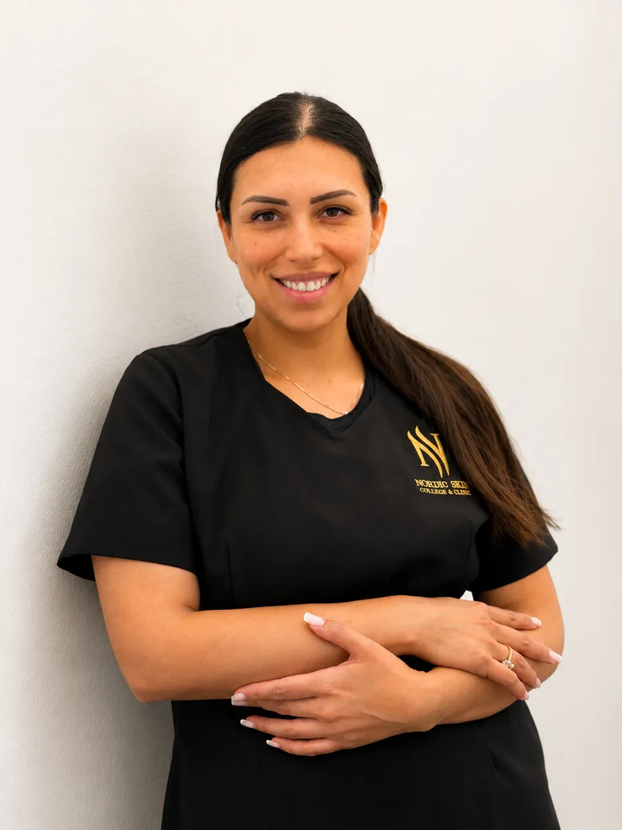 Lucia, cosmetology student at Nordic Skin College at Kongens Nytorv, in the school uniform